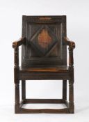 17th Century oak Wainscot chair, circa 1640, the single panel diamond and carved back surmounted