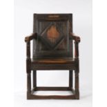 17th Century oak Wainscot chair, circa 1640, the single panel diamond and carved back surmounted