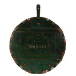 Large early 20th Century German painted serving board, the circular green painted board with