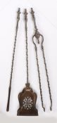 George III set of three steel fire irons, each with a finial topped handle above a spiral stem, to