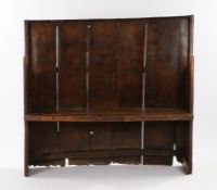 Charming George III boarded elm bow back settle, West Country, circa 1800, of small proportions, the