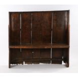 Charming George III boarded elm bow back settle, West Country, circa 1800, of small proportions, the