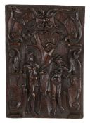 Circa 1600 oak panel, carved with Adam and Eve under the forbidden tree with a snake coiled