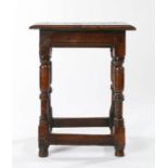 Charles I oak joint stool, circa 1630, having a deep ovolo-moulded edge top, edge-moulded rails, and