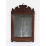 George III mahogany wall mirror, the original rectangular plate with an arched pediment above the