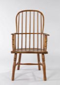 19th Century ash and elm Lincolnshire Windsor armchair, the arched back with spindles above a