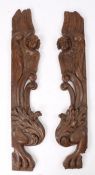 Pair of large late 17th Century carved oak architectural pilasters, with winged angles above scrolls