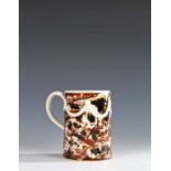 Fine 18th Century Mocha Ware mug, the mug with a cream Adams type ribbon swag with a cream handle