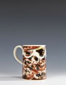 Fine 18th Century Mocha Ware mug, the mug with a cream Adams type ribbon swag with a cream handle