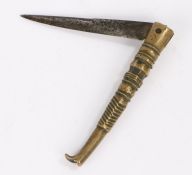 Early 19th Century Spanish folding knife, the brass grip in the form of a long leg and boot to the