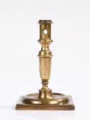 Spanish late 17th Century candlestick, the baluster stem above a ring and square foot, 17cm high