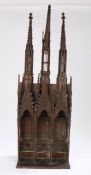 A good 19th Century mahogany model, of a church section with three spires above three arches