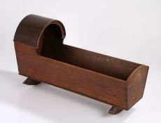 George III oak toy cot, the arched canopy above a tapering body and arched supports, 52.5cm long