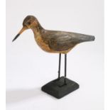 Early 20th Century Shorebird decoy, with a long beak and carved wings and painted body, 31cm long