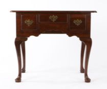 George III oak lowboy, having a twin-boarded and round front corner top, an ogee-arched apron