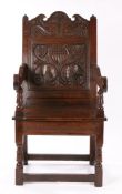 Charles I oak wainscot armchair, Lancashire/North Cheshire, circa 1670, the carved cresting with two