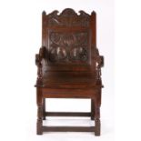 Charles I oak wainscot armchair, Lancashire/North Cheshire, circa 1670, the carved cresting with two