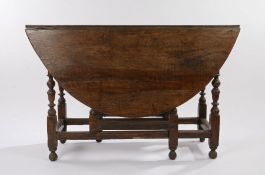 18th Century oak gate leg table, with D shaped leaves, raised on turned legs and chamfered