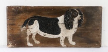 Charming Folk Art painted panel, of a black and white King Charles Spaniel, 61cm x 26cm