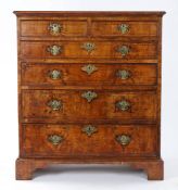 George I walnut tall chest of drawers, the rectangular top with box wood stringing above two short