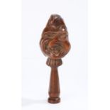 18th Century English yew wood grotesque face nutcracker, having a twisted face and projecting nose