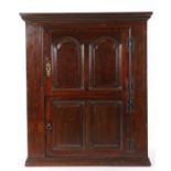 George II oak and walnut crossbanded wall cupboard, Welsh, circa 1750, with two doors, the upper