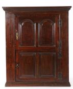 George II oak and walnut crossbanded wall cupboard, Welsh, circa 1750, with two doors, the upper