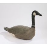 Early 20th Century decoy goose, the canvas body painted white, black and grey and a hook to the