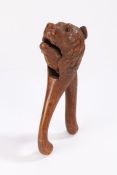 19th Century nutcracker, carved in softwood as a bear with a wide opening mouth, 20cm long