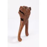 19th Century nutcracker, carved in softwood as a bear with a wide opening mouth, 20cm long