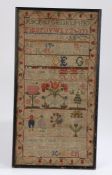 18th Century Scottish sampler, depicting an upper case alphabet, various flowers and a tree below