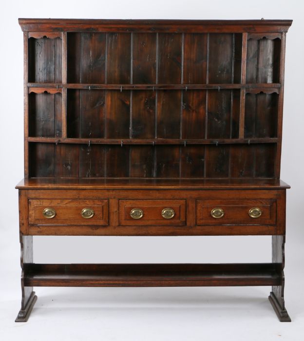 George III oak dresser base and rack, possibly Cornish, the rack with two shelves, the base with