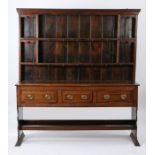 George III oak dresser base and rack, possibly Cornish, the rack with two shelves, the base with