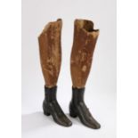 Pair of Victorian Shop window display iron boots, with card legs inserted in to the boots, the