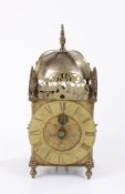 18th Century brass lantern clock, of large proportions, the finial top above four brass arched