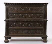 17th Century and later oak chest, the rectangular top above four long flower head carved drawers