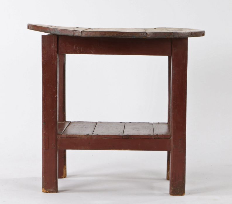 19th Century Irish Tavern table, the circular pine top above a red painted base and plank bottom,