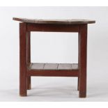 19th Century Irish Tavern table, the circular pine top above a red painted base and plank bottom,