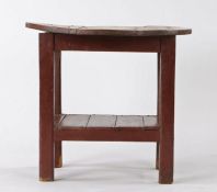 19th Century Irish Tavern table, the circular pine top above a red painted base and plank bottom,