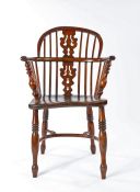 19th Century oak elm and yew Lincolnshire Windsor chair, the arched back with spindles and shaped