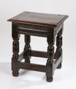 Charles I oak low stool, circa 1640, the rectangular top above a moulded frieze on baluster legs