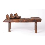 19th Century cobblers bench, the rectangular top with leather strap work to the centre and one end