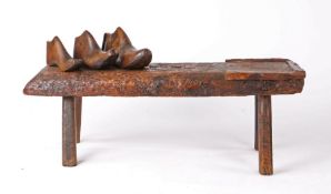 19th Century cobblers bench, the rectangular top with leather strap work to the centre and one end