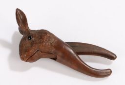 19th Century nutcracker, carved in softwood as a rabbit/hare set with dark coloured eyes, 16cm long