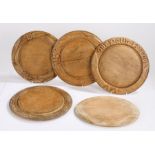 Collection of five treen breadboards, the first with the text Our Daily Bread, 29cm wide, another