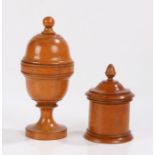 Two Victorian boxwood treen objects, the first in the form of a lidden urn, the final hiding a