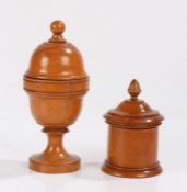 Two Victorian boxwood treen objects, the first in the form of a lidden urn, the final hiding a