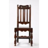 Late 17th Century oak slat back chair, circa 1690, with a scroll and arched top rail above three