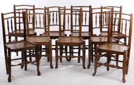 Matched set of nine 19th Century oak and elm chairs, with spindle backs above plank seats and turned