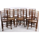 Matched set of nine 19th Century oak and elm chairs, with spindle backs above plank seats and turned